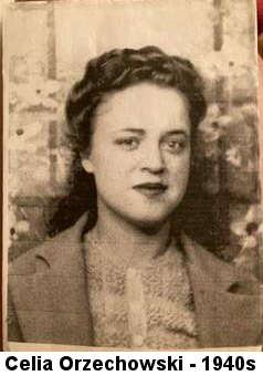 Rose-tinged portrait photo (possibly from a newspaper) of a full-lipped young woman with dark hair curled on top of her head and falling down behind her neck in a characteristic 1940s style. She is wearing a blazer with wide lapels and a printed blouse.